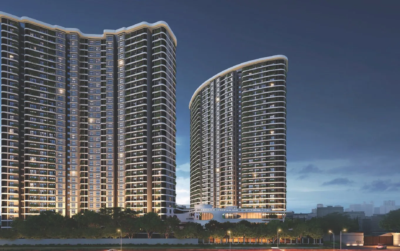 Siddha Serena towers lit up at dusk