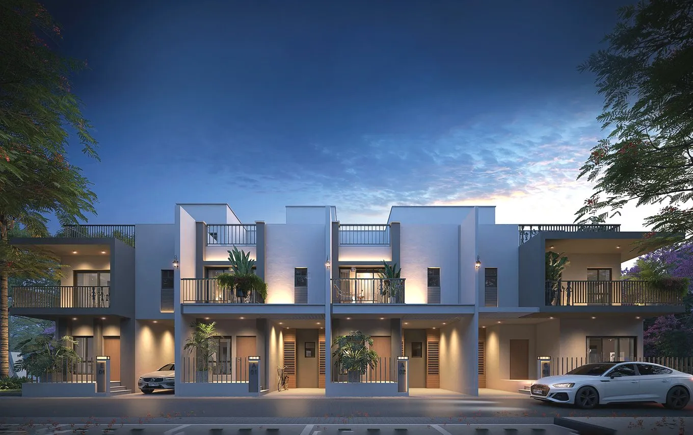 Embassy villas lit up at dusk