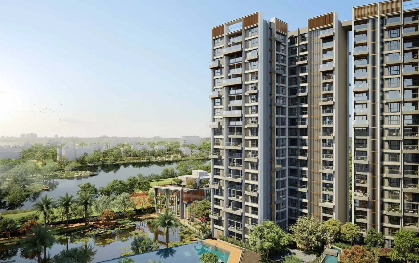 Godrej Blue towers rising beside the pond and podium gardens