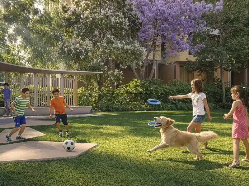 Children and a dog playing beside the boomerang seating