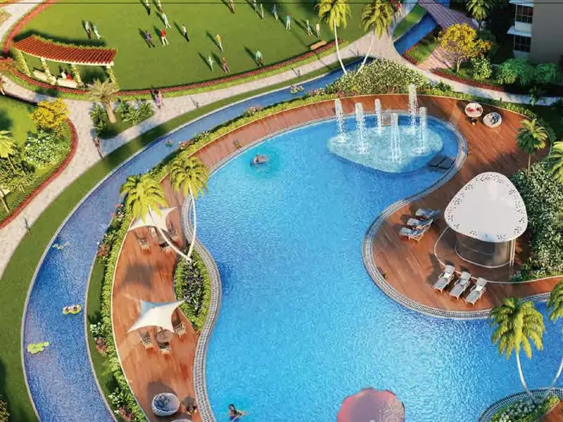 Podium swimming pool with deck loungers and shade sails