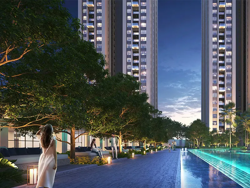 Tree-lined poolside promenade at dusk